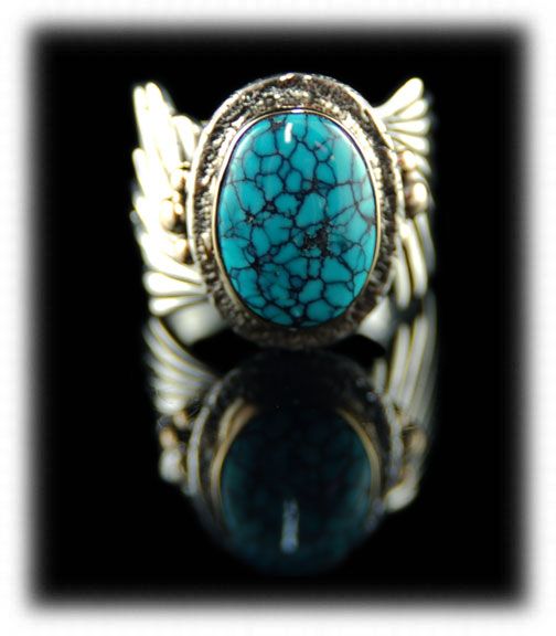 SIlver and Gold ring with Black Number Eight Spiderweb Turquoise Cabochon