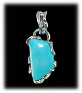 Hand carved Sterling Silver and Sleeping Beauty Turquoise pendant