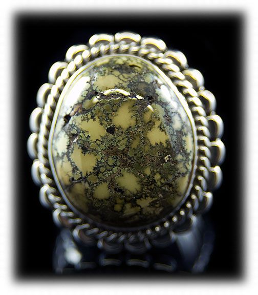 Yellow Damele Spiderweb Turquoise Cabochon in a ring