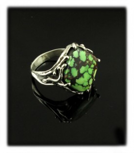Here is an artisan handmade silver cocktail ring  with lime green Tibetan spiderweb Turquoise 