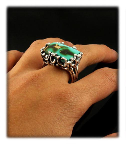 Here is a wonderful example of a handmade silver cocktail ring made in the lost wax style featuring natural Pilot Mountain Turquoise from Nevada